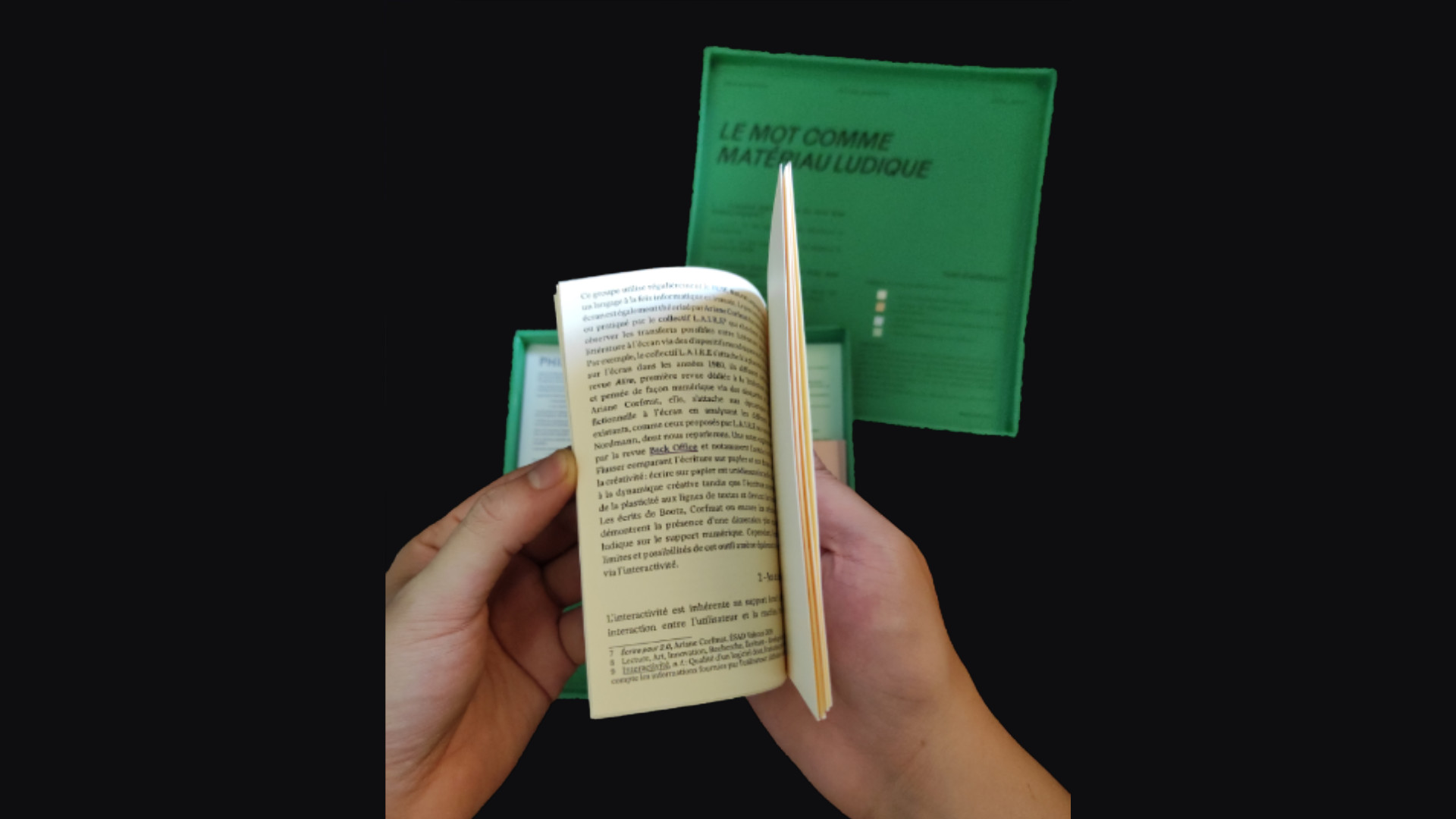 Zoom on the cream coloured cards. It is the thesis text.
