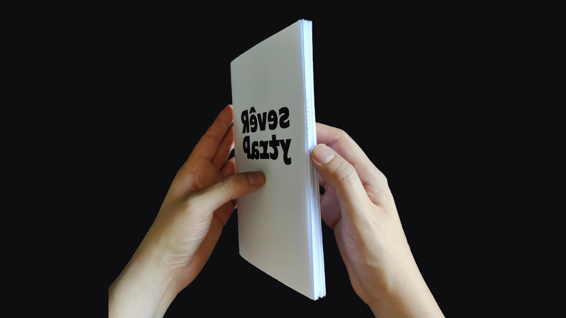 The booklet held closed, we can see the title alone on the front cover.